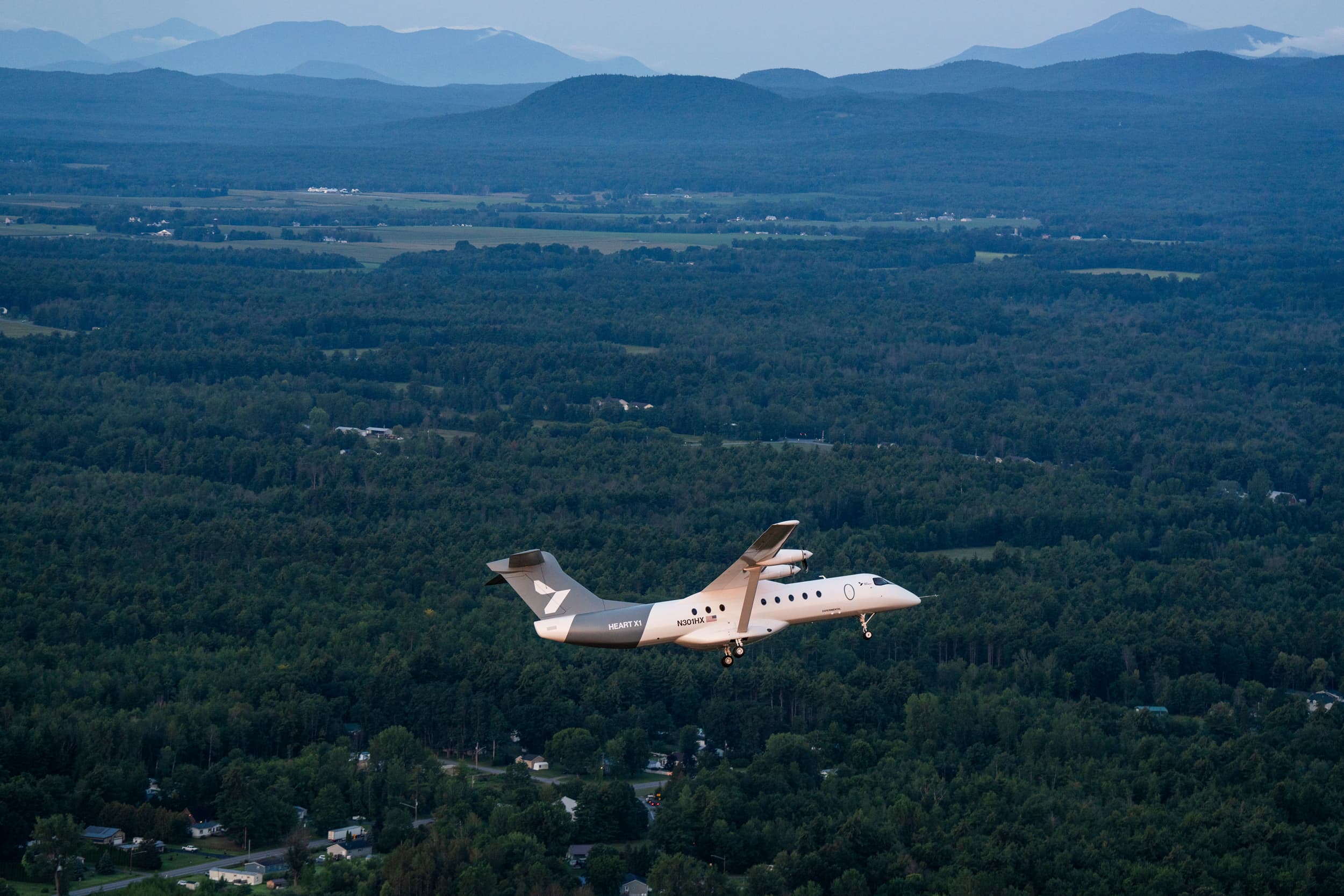 Heart Aerospace’s battery-electric X1 demonstrator maneuvers above the woodlands of New York.